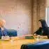 man and woman talking inside office